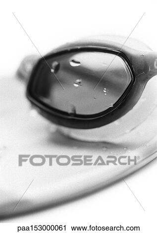 Stock Image - Swimming goggles, close-up, b&w.. Fotosearch