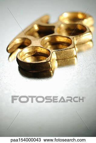 Brass knuckles, close-up. View Large Photo Image Stock Image - Brass knuckles, close-up.. Fotosearch