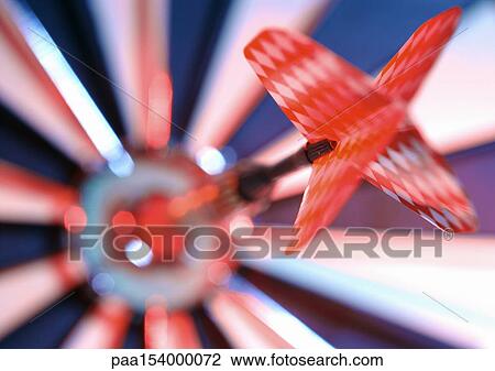 Dart in bulseye of dartboard, close-up. View Large Photo Image Stock Image - Dart in bulseye of dartboard, close-up.. Fotosearch