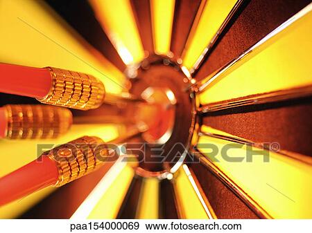 Darts in bullseye of dartboard, close-up. View Large Photo Image Stock Photo - Darts in bullseye of dartboard, close-up.. Fotosearch