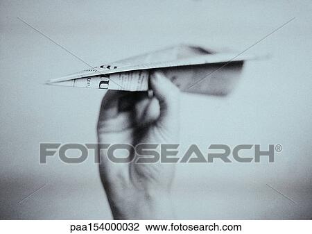 Hand holding paper airplane, close-up, b&w. View Large Photo Image Stock Image - Hand holding paper airplane, close-up, b&w.. Fotosearch