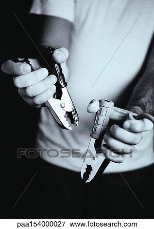 Hands holding electric jump cables, b&w. View Large Photo Image Stock Photo - Hands holding electric jump cables, b&w.. Fotosearch