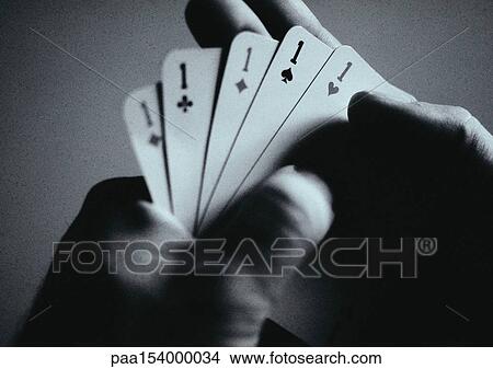 Hands holding playing cards, close-up, b&w. View Large Photo Image Picture - Hands holding playing cards, close-up, b&w.. Fotosearch