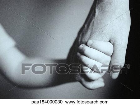 Man and child holding hands, close-up, b&w. View Large Photo Image Stock Image - Man and child holding hands, close-up, b&w.. Fotosearch