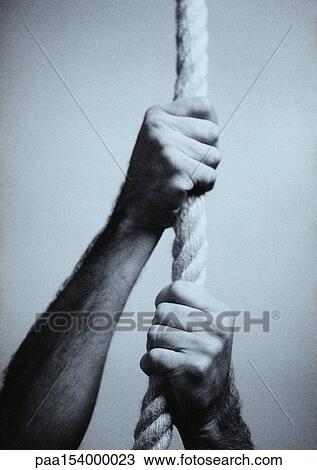 Man's hand holding rope, b&w. View Large Photo Image Stock Image - Man's hand holding rope, b&w.. Fotosearch
