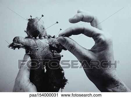 Man's hands putting pins into primitive doll, close-up, b&w. View Large Photo Image Stock Image - Man's hands putting pins into primitive doll, close-up, b&w.. Fotosearch