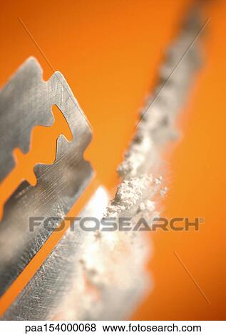 Razor blade and line of cocaine, close-up. View Large Photo Image Stock Photo - Razor blade and line of cocaine, close-up.. Fotosearch