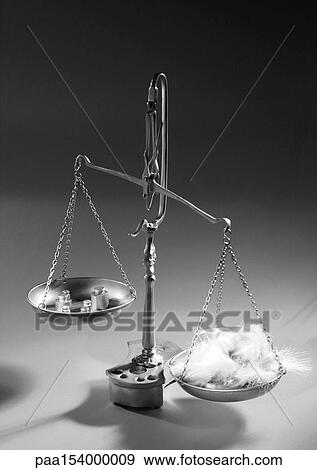 Scales holding feathers on one side and weights on the other, b&w. View Large Photo Image Stock Photo - Scales holding feathers on one side and weights on the other, b&w.. Fotosearch