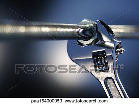 Wrench locked onto nut, close-up. View Large Photo Image Stock Image - Wrench locked onto nut, close-up.. Fotosearch