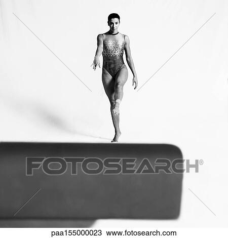 Female gymnast about to mount beam, b&w. View Large Photo Image Stock Image - Female gymnast about to mount beam, b&w.. Fotosearch