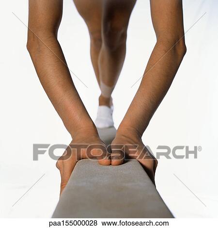 Female gymnast on balance beam, hands and legs, close-up. View Large Photo Image Stock Photo - Female gymnast on balance beam, hands and legs, close-up.. Fotosearch