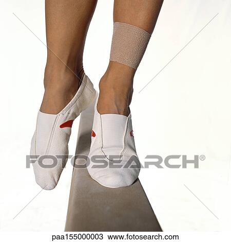 Female gymnast's feet balancing on balance beam, close-up. View Large Photo Image Stock Image - Female gymnast's feet balancing on balance beam, close-up.. Fotosearch