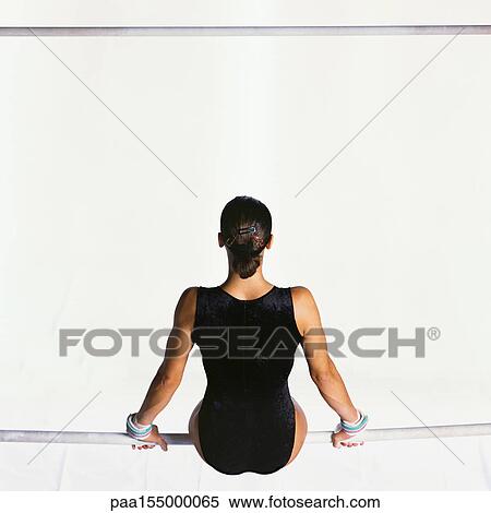 Female, sitting on uneven bar, rear view. View Large Photo Image Stock Photography - Female, sitting on uneven bar, rear view.. Fotosearch