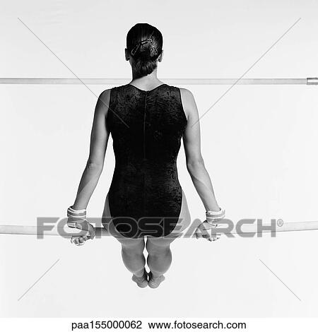 Female sitting on uneven bars, rear view, b&w. View Large Photo Image Stock Image - Female sitting on uneven bars, rear view, b&w.. Fotosearch