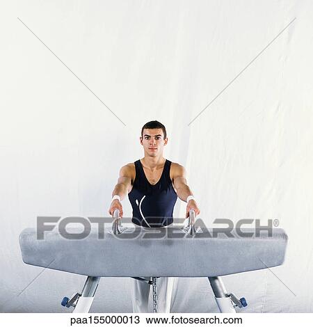 Gymnast mounting pommel horse. View Large Photo Image Stock Image - Gymnast mounting pommel horse.. Fotosearch