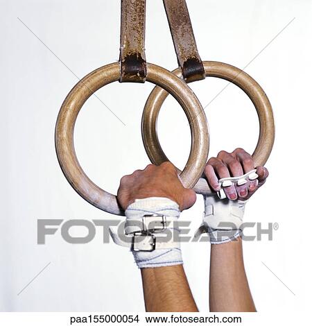 Gymnast's hands holding rings, side view, close-up. View Large Photo Image Picture - Gymnast's hands holding rings, side view, close-up.. Fotosearch