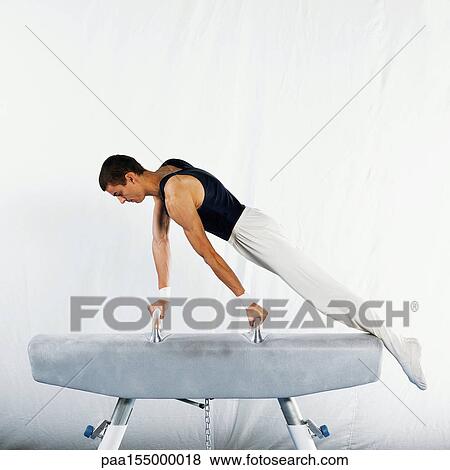 Male gymnast on pommel horse, side view. View Large Photo Image Stock Photo - Male gymnast on pommel horse, side view.. Fotosearch
