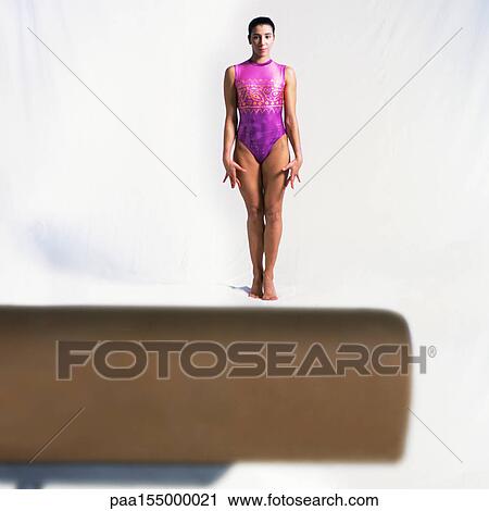 Young female standing in front of pommel horse. View Large Photo Image Stock Image - Young female standing in front of pommel horse.. Fotosearch