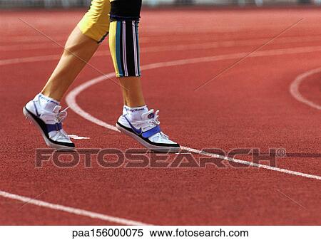 Athlete's legs, low section, close-up View Large Photo Image Stock Photography - Athlete's legs, low section, close-up. Fotosearch