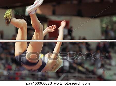 Female high jumper clearing bar View Large Photo Image Stock Image - Female high jumper clearing bar. Fotosearch