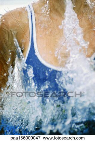 Female swimmer emerging from water, close-up View Large Photo Image Stock Photo - Female swimmer emerging from water, close-up. Fotosearch