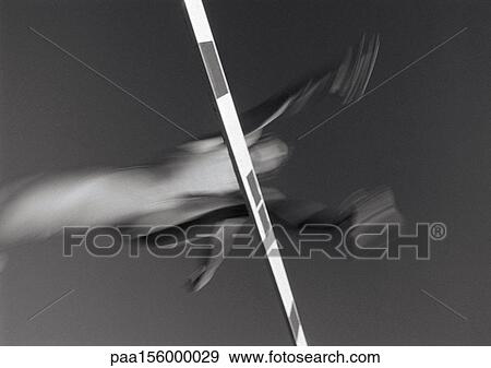 Male athlete jumping hurdle, low angle view, blurred motion, b&w View Large Photo Image Stock Photo - Male athlete jumping hurdle, low angle view, blurred motion, b&w. Fotosearch