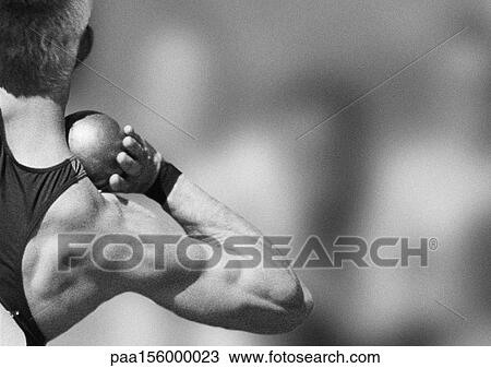 Male athlete preparing to throw shot put, rear view, b&w View Large Photo Image Stock Image - Male athlete preparing to throw shot put, rear view, b&w. Fotosearch