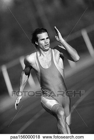 Stock Photo - Male athlete running, close-up, b&w. Fotosearch