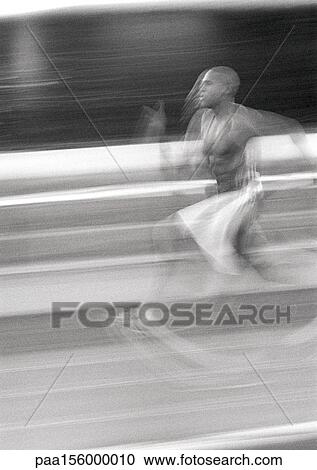 Male athlete running fast, blurred motion, b&w View Large Photo Image Stock Image - Male athlete running fast, blurred motion, b&w. Fotosearch
