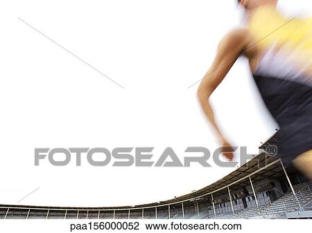 Stock Image - Male athlete running fast, blurred motion. Fotosearch