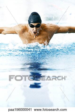 Male athlete swimming butterfly stroke, close-up View Large Photo Image Stock Image - Male athlete swimming butterfly stroke, close-up. Fotosearch