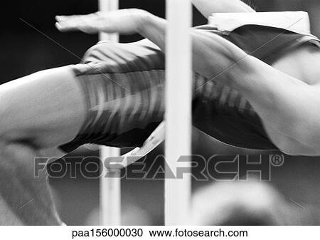 Male high jumper clearing bar, close-up, b&w View Large Photo Image Stock Image - Male high jumper clearing bar, close-up, b&w. Fotosearch