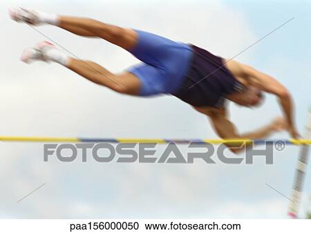 Male pole vaulter in mid-air, low angle view, blurred motion View Large Photo Image Stock Image - Male pole vaulter in mid-air, low angle view, blurred motion. Fotosearch