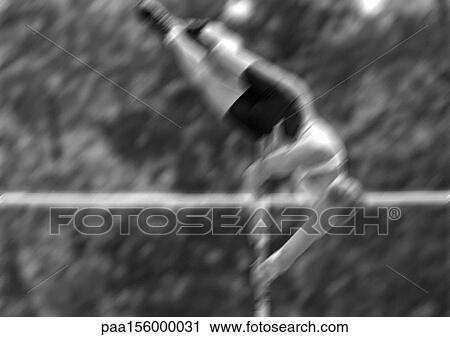 Stock Image - Male pole vaulter swinging up, blurred motion, b&w. Fotosearch