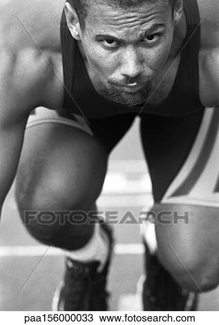 Male runner at start of race, close-up, b&w View Large Photo Image Stock Image - Male runner at start of race, close-up, b&w. Fotosearch