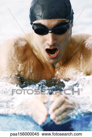 Male swimmer taking breath, close-up View Large Photo Image Stock Photography - Male swimmer taking breath, close-up. Fotosearch