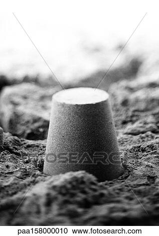 Bucket-shaped pile of sand, b&w. View Large Photo Image Stock Image - Bucket-shaped pile of sand, b&w.. Fotosearch