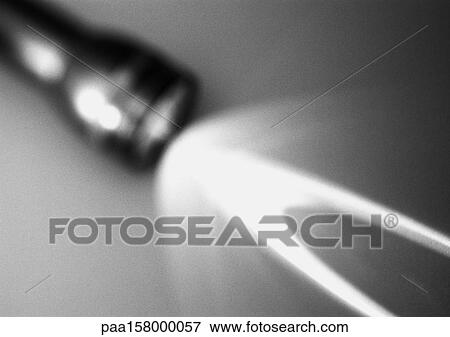 Stock Photo - Flashlight, blurred, b&w.. Fotosearch