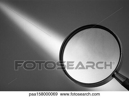 Stock Photo - Magnifying glass, b&w.. Fotosearch
