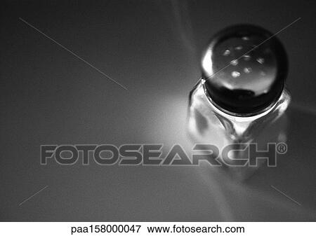 Stock Photo - Salt shaker, elevated view, b&w.. Fotosearch