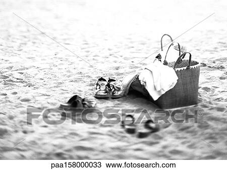 Shoes and bag on the beach, b&w. View Large Photo Image Stock Image - Shoes and bag on the beach, b&w.. Fotosearch