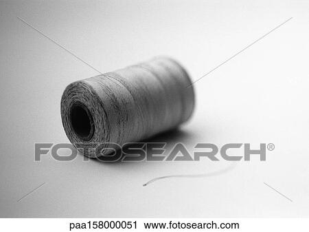 Spool of thread, b&w. View Large Photo Image Stock Image - Spool of thread, b&w.. Fotosearch