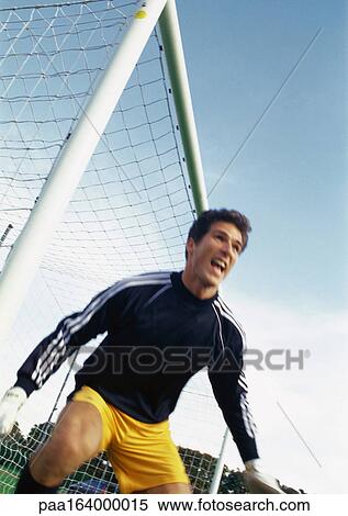 Goal keeper at soccer match, portrait. View Large Photo Image Stock Photography - Goal keeper at soccer match, portrait.. Fotosearch
