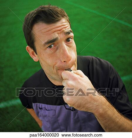 Referee blowing whistle, looking into camera, portrait. View Large Photo Image Stock Image - Referee blowing whistle, looking into camera, portrait.. Fotosearch