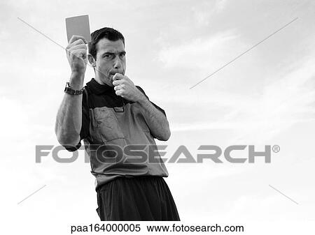 Referee in soccer match holding up card, b&w. View Large Photo Image Stock Photography - Referee in soccer match holding up card, b&w.. Fotosearch