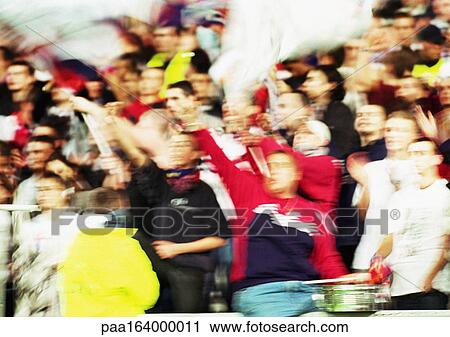 Soccer fans at a match, blurred. View Large Photo Image Stock Image - Soccer fans at a match, blurred.. Fotosearch