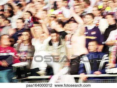 Soccer fans at a match, blurred. View Large Photo Image Stock Image - Soccer fans at a match, blurred.. Fotosearch