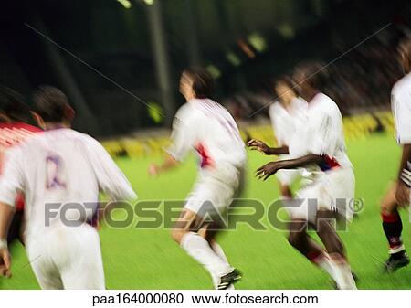 Soccer players during a match, rear view. View Large Photo Image Stock Image - Soccer players during a match, rear view.. Fotosearch