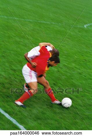 Two soccer players fighting for ball. View Large Photo Image Stock Photograph - Two soccer players fighting for ball.. Fotosearch