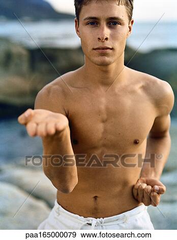 Man looking into camera performing martial arts, close-up, portrait. View Large Photo Image Stock Photo - Man looking into camera performing martial arts, close-up, portrait.. Fotosearch